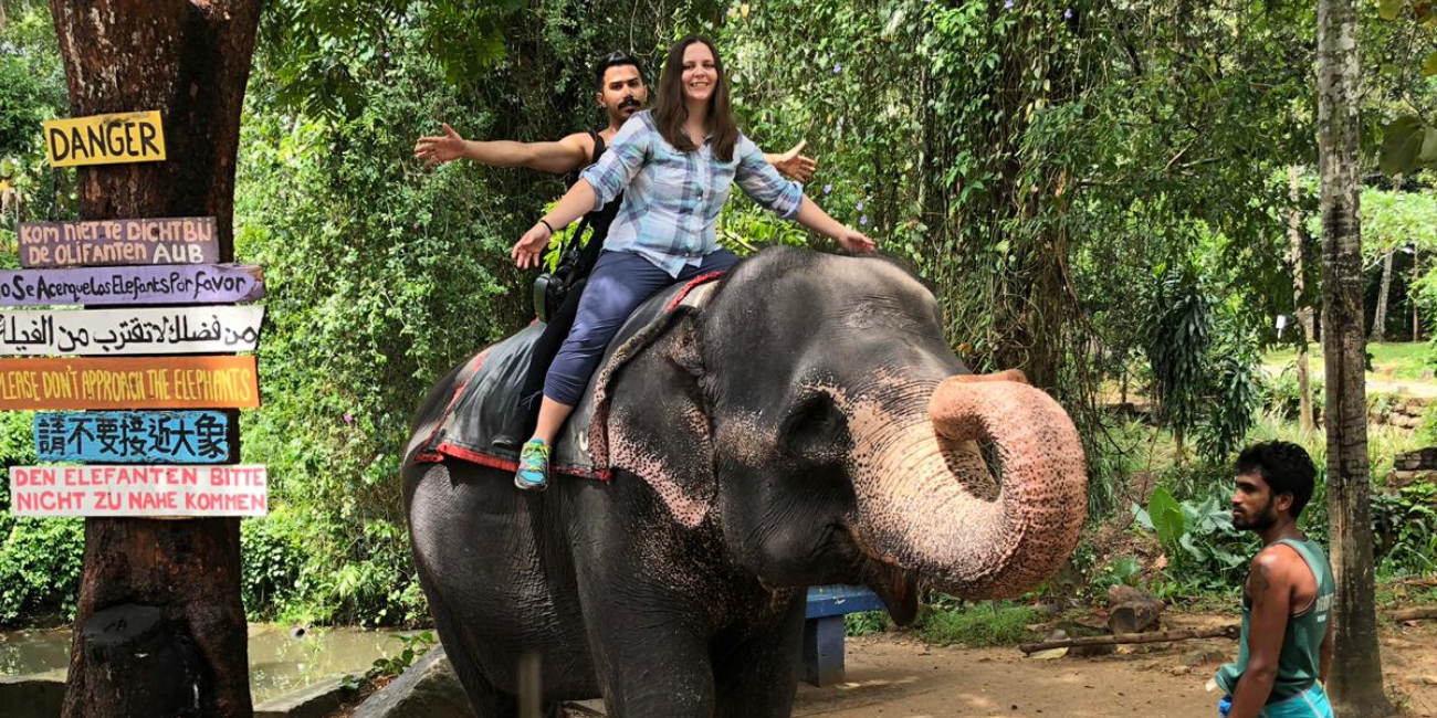 photo of Kim Lally riding elephant