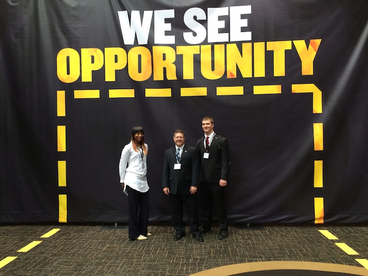 enactus club members at a conference