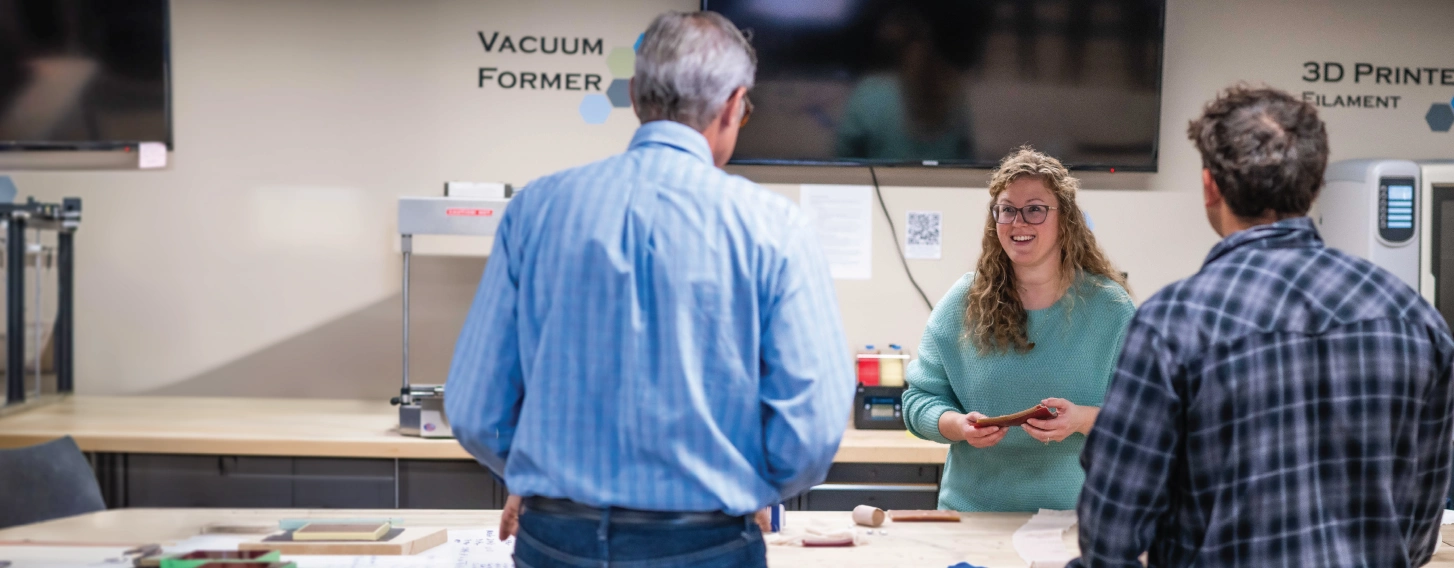 A group of people in an industrial engineering lab.